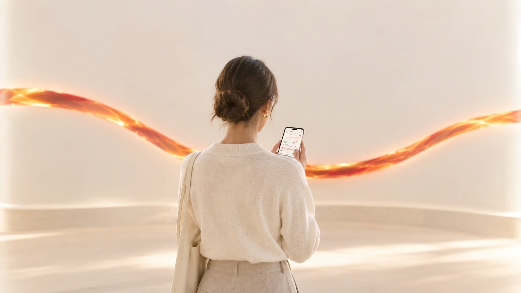 Seen from behind, a person in a cream jumper checks their phone in front of a glowing magma ribbon